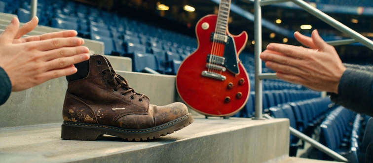 Which epic 1977 Queen masterpiece features that legendary, stadium-shaking stomp-stomp-clap rhythm?