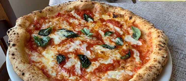 Let's kick off this delicious playlist: which country is world-famous for dropping the first Pizza?